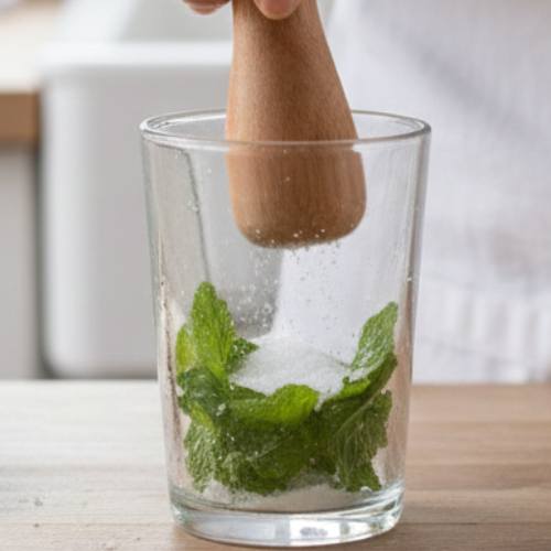 Step 2: Muddle the Mint and Sugar