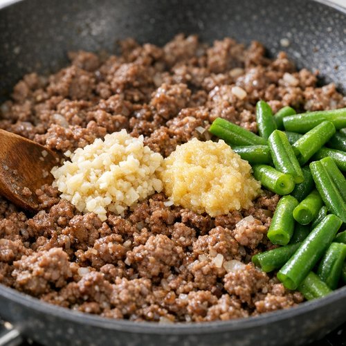 Step 2: Add Aromatics and Green Beans